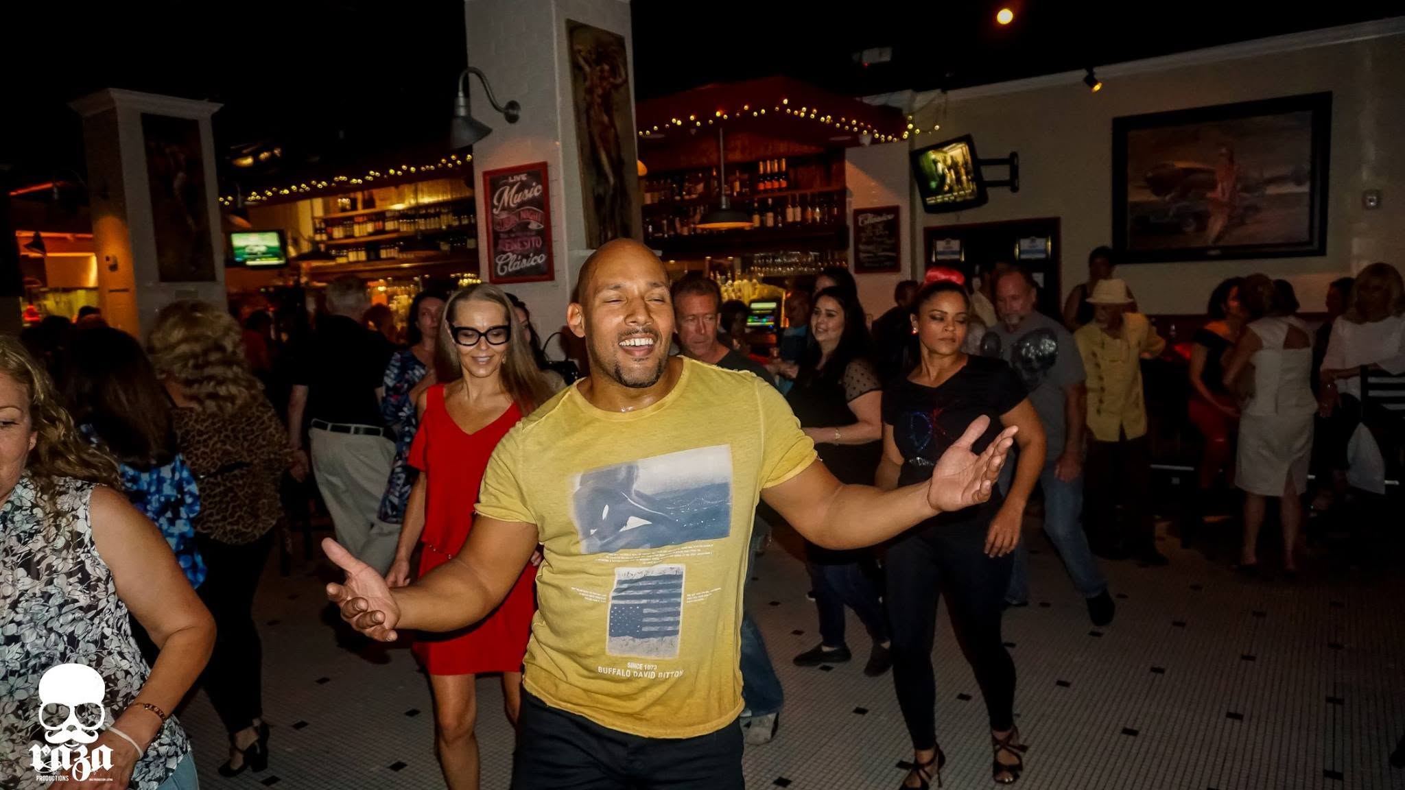 Dario and the DK community having fun at a Latin dance night