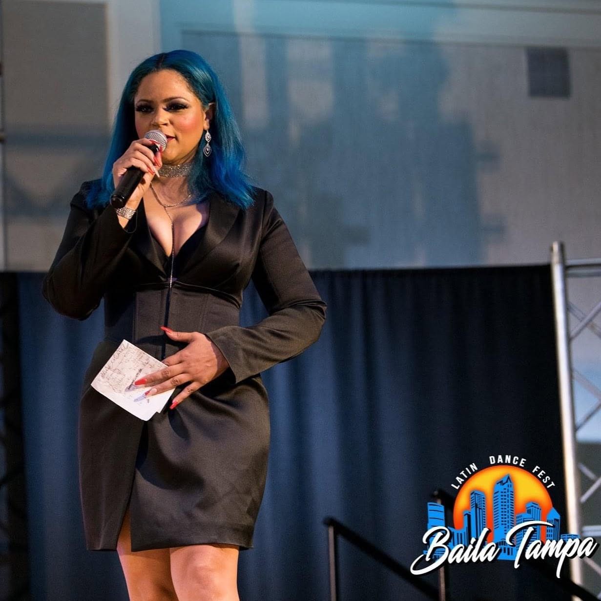 Kery representing the community at a Latin dance festival