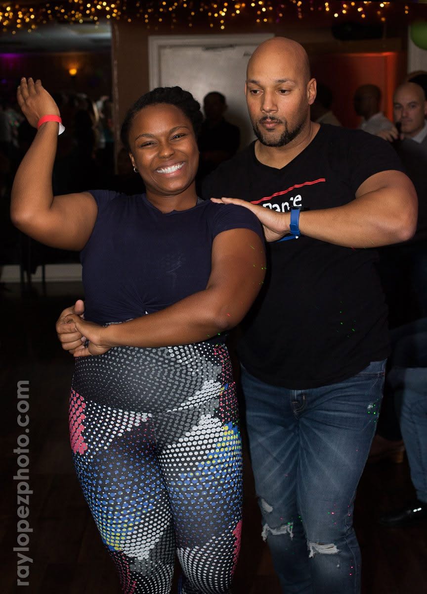 A smiling dancer sharing a bachata moment with Dario